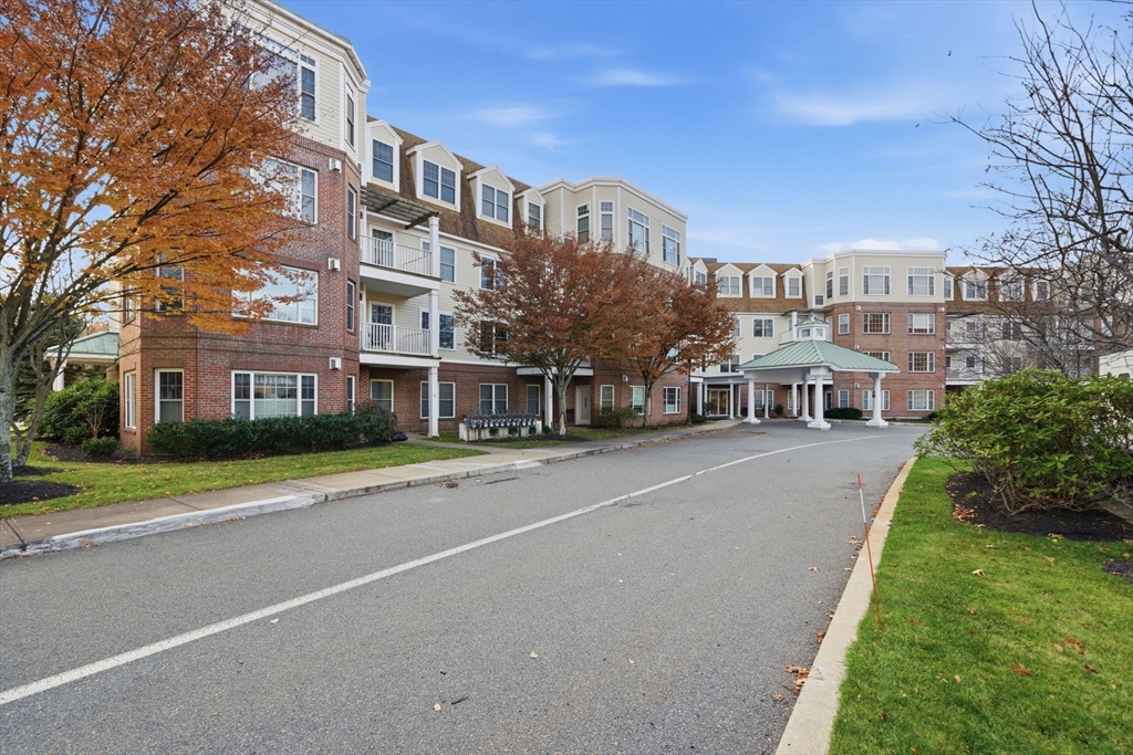295 Salem Street, Unit 82 Woburn, MA 01801 - Photo 32 of 36 a view of a city with tall buildings
