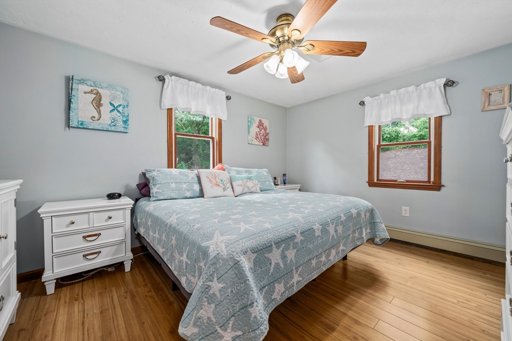 7 Signal Hill Road Marshfield, MA 02050 - Photo 14 of 42 a bedroom with a bed dresser and a window