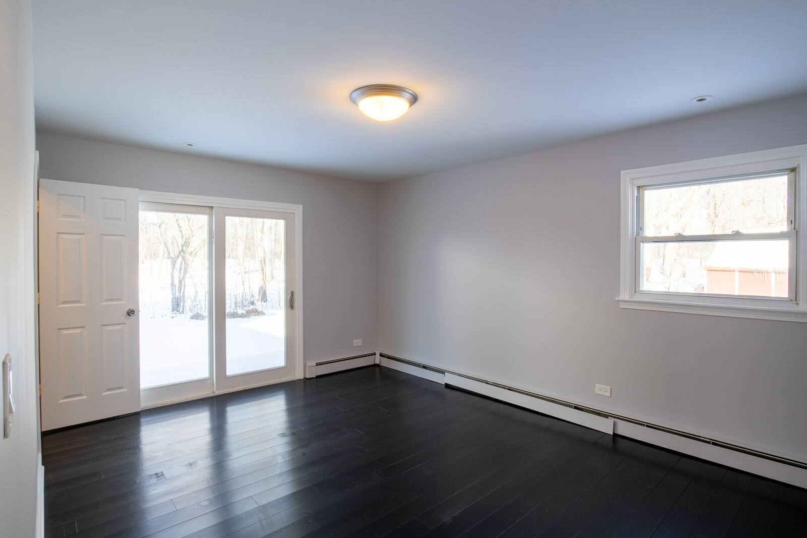 2950 Riverwoods Road Riverwoods, IL 60015 - Photo 15 of 25 a view of an empty room with wooden floor and a window