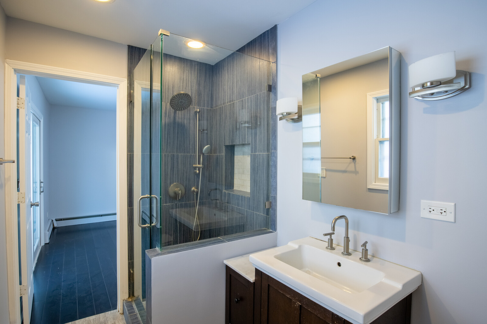 2950 Riverwoods Road Riverwoods, IL 60015 - Photo 18 of 25 a bathroom with a sink a mirror and shower