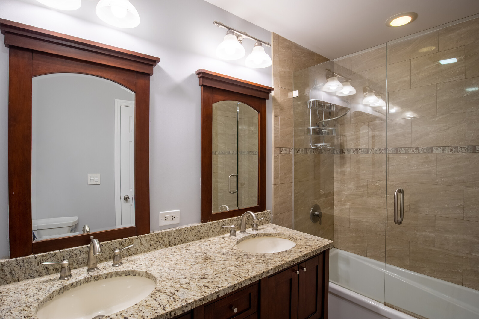 2950 Riverwoods Road Riverwoods, IL 60015 - Photo 19 of 25 a bathroom with a granite countertop sink a mirror and a shower