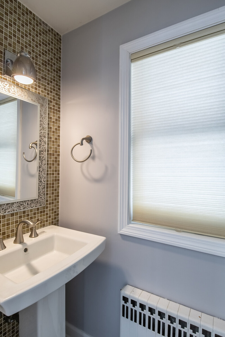 2950 Riverwoods Road Riverwoods, IL 60015 - Photo 21 of 25 a bathroom with a sink and a mirror