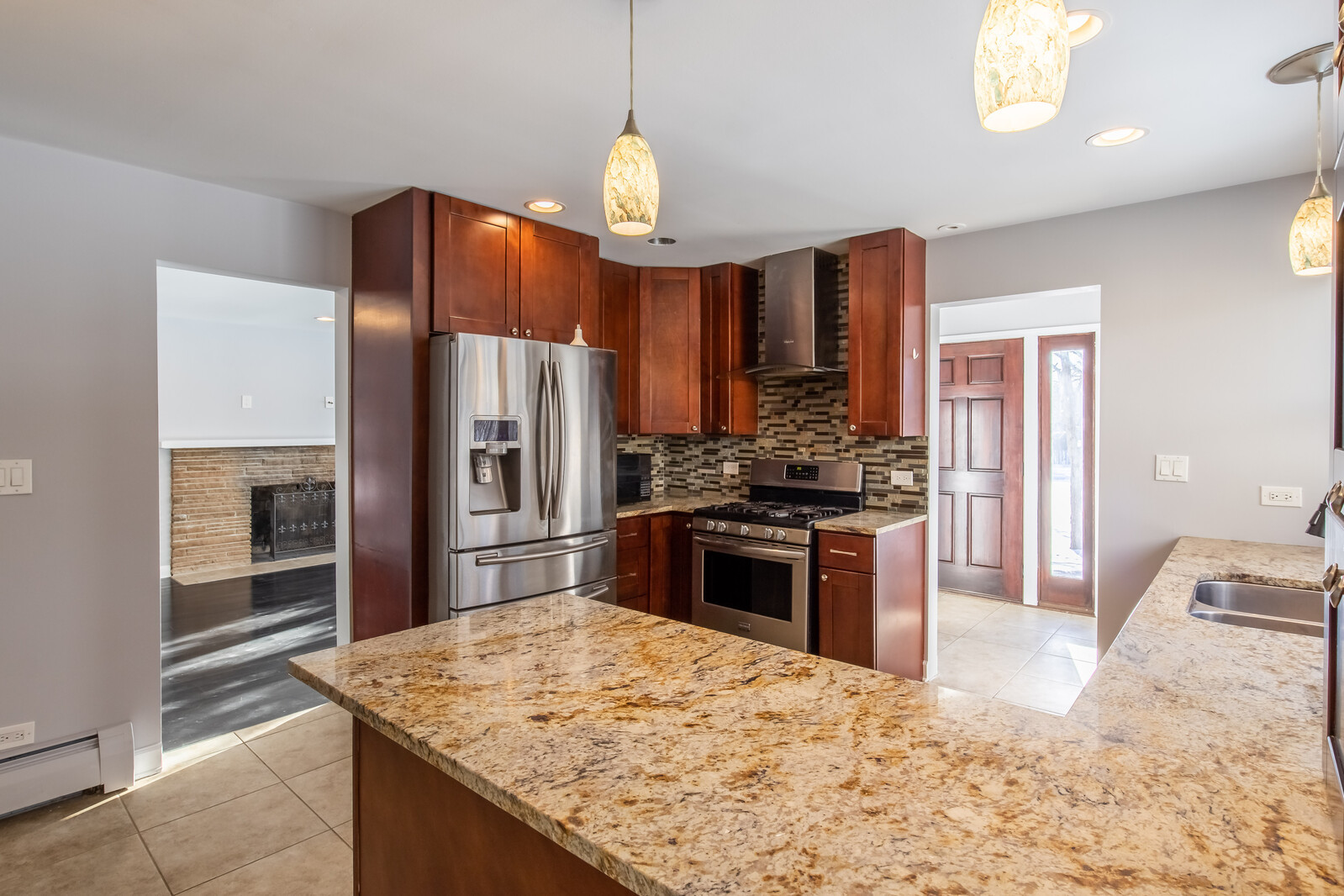 2950 Riverwoods Road Riverwoods, IL 60015 - Photo 7 of 25 a kitchen with stainless steel appliances kitchen island granite countertop a refrigerator stove and oven