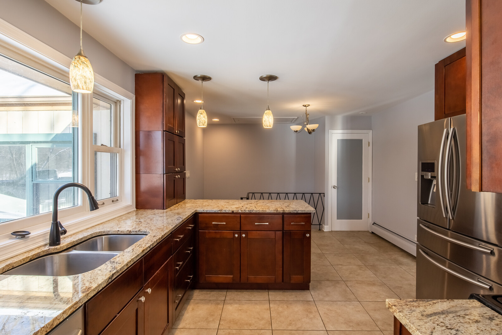 2950 Riverwoods Road Riverwoods, IL 60015 - Photo 8 of 25 a kitchen with a sink and a refrigerator