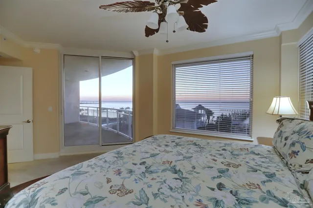 a bedroom with furniture and a window