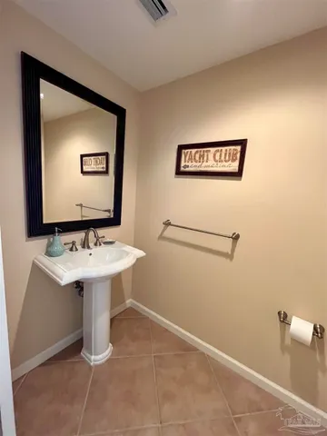 a bathroom with a sink a mirror and a toilet