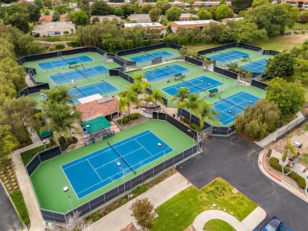 an aerial view of a pool patio chairs and a fire pit
