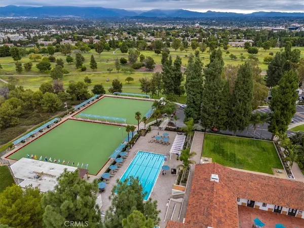 an aerial view of a houses with a yard
