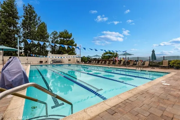 a view of a swimming pool with a terrace