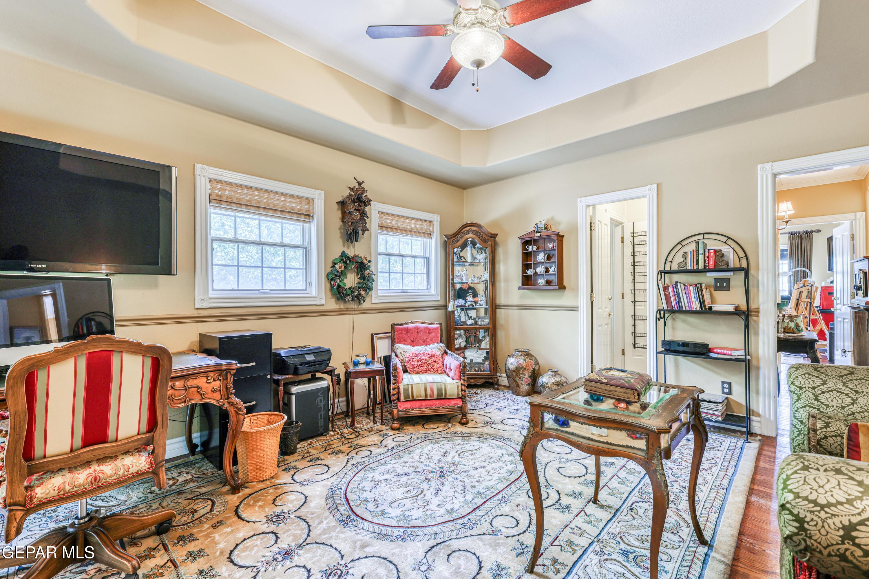 501 Country Club Road El Paso, TX 79932 - Photo 63 of 88 a living room with fireplace furniture and a flat screen tv