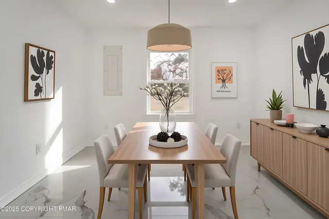 a dining room with furniture and window