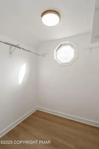 an empty room with a empty space and a window
