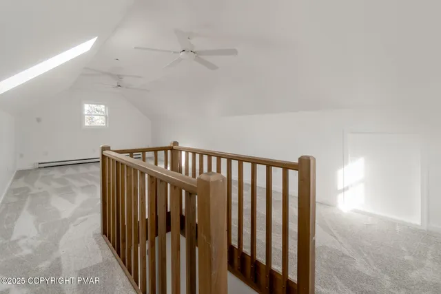 a view of a hallway with stairs