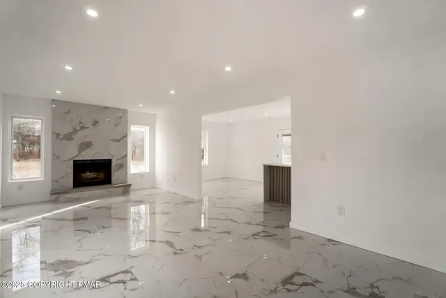 a view of a hallway with an empty room