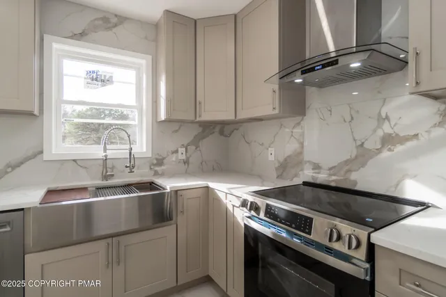 a kitchen with a stove and a sink