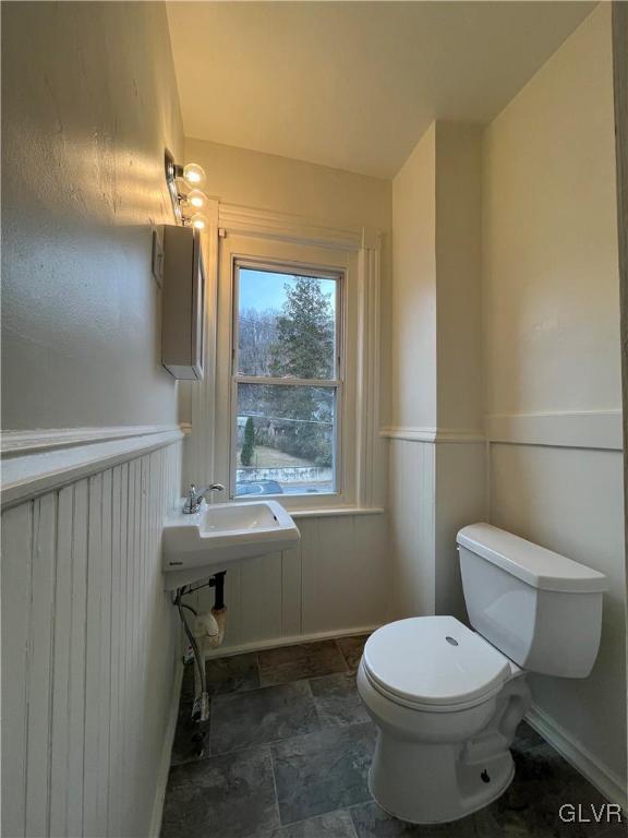 144 Jamestown Street Lehighton, PA 18235 - Photo 13 of 14 a bathroom with a toilet a sink and a mirror