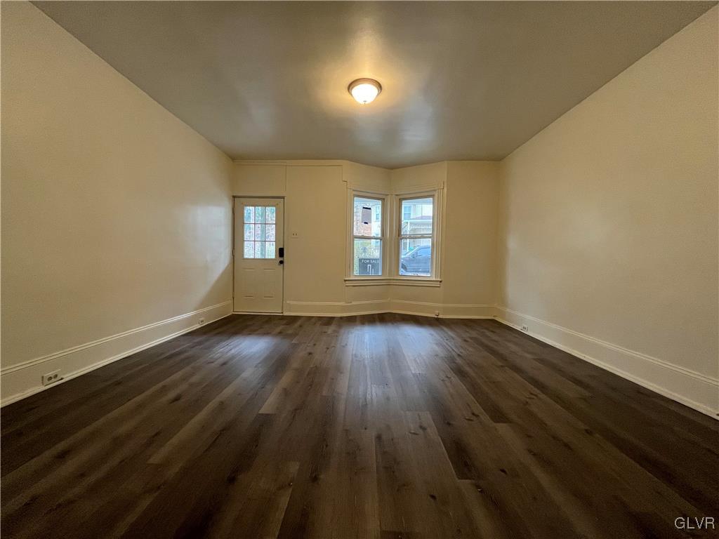 144 Jamestown Street Lehighton, PA 18235 - Photo 2 of 14 a view of an empty room with wooden floor and a window