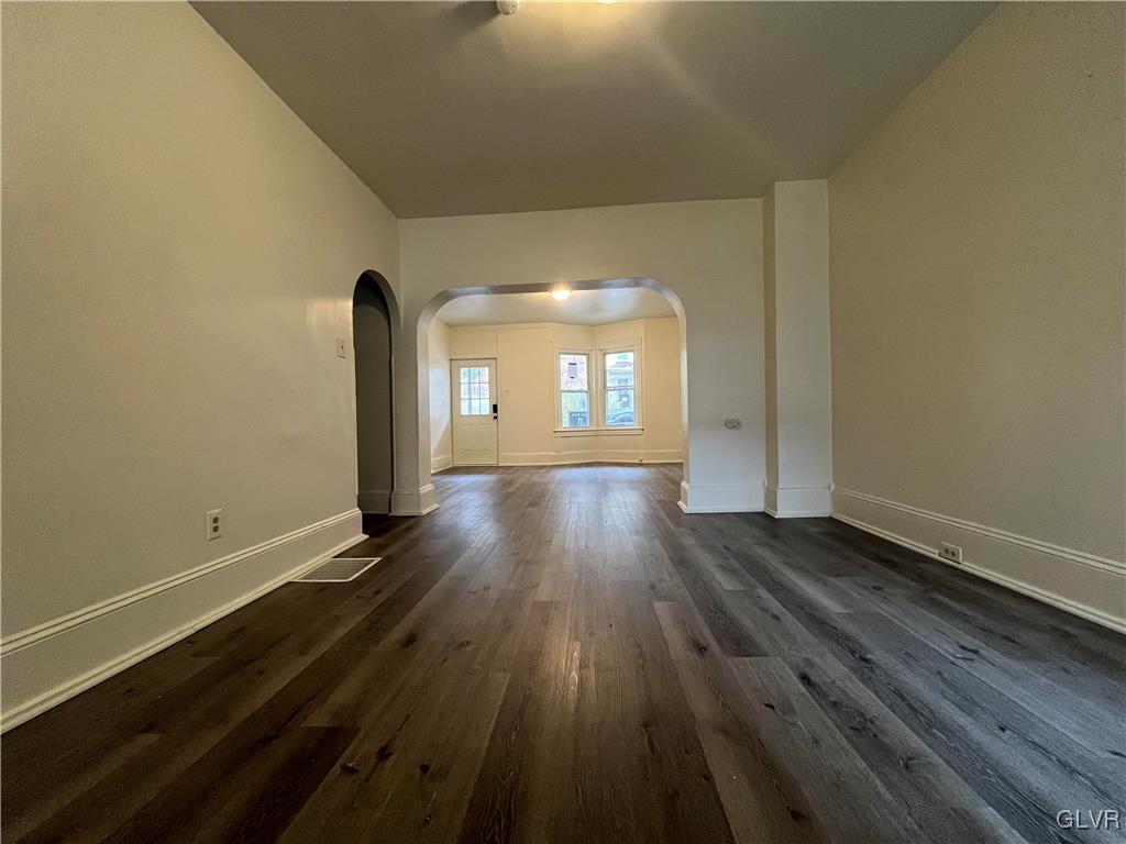 144 Jamestown Street Lehighton, PA 18235 - Photo 3 of 14 an empty room with wooden floor and windows