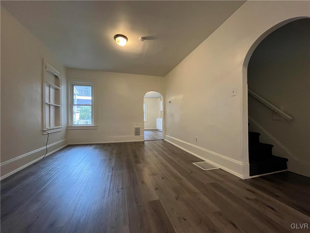 144 Jamestown Street Lehighton, PA 18235 - Photo 4 of 14 an empty room with wooden floor and window