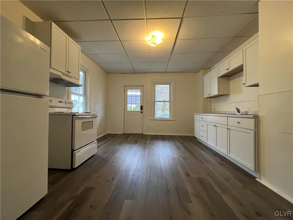 144 Jamestown Street Lehighton, PA 18235 - Photo 6 of 14 a kitchen with stainless steel appliances granite countertop a dishwasher a stove a refrigerator with white cabinets and wooden floor