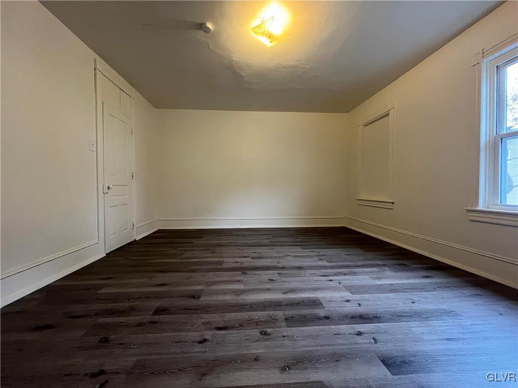 144 Jamestown Street Lehighton, PA 18235 - Photo 8 of 14 a view of an empty room with wooden floor and a window