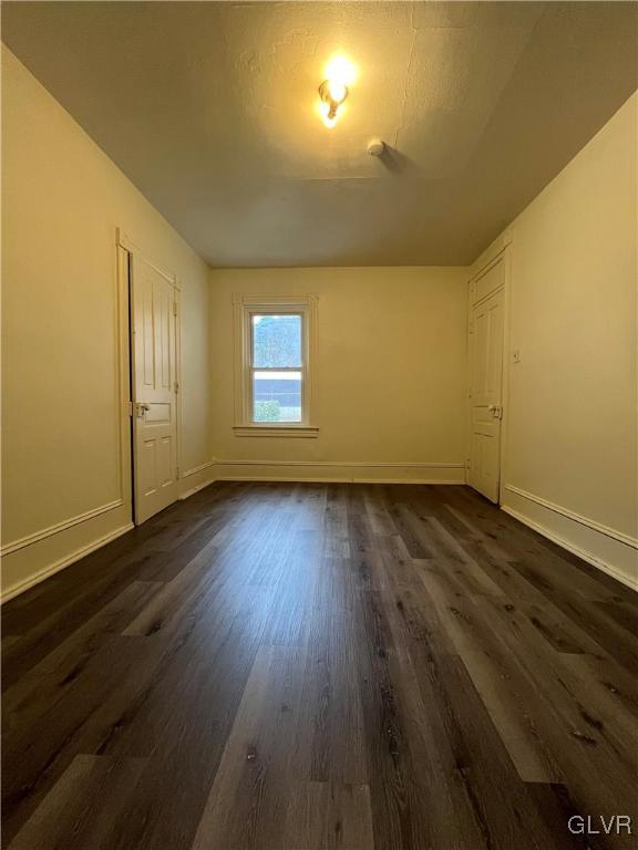 144 Jamestown Street Lehighton, PA 18235 - Photo 9 of 14 an empty room with wooden floor and windows