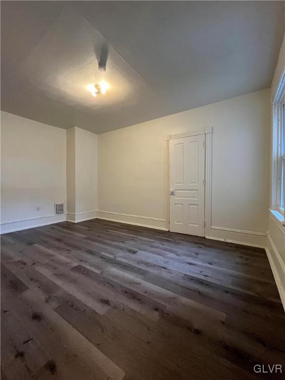 144 Jamestown Street Lehighton, PA 18235 - Photo 10 of 14 an empty room with wooden floor and windows
