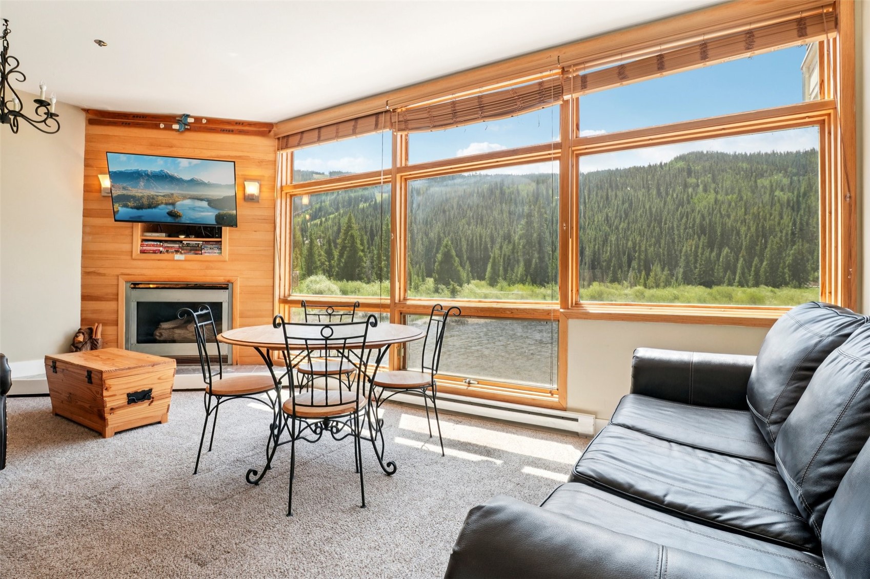 24 River Run Road, Unit 2907 Keystone, CO 80435 - Photo 5 of 37 a living room with furniture a fireplace and a floor to ceiling window