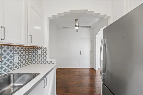a view of a kitchen cabinets and a sink