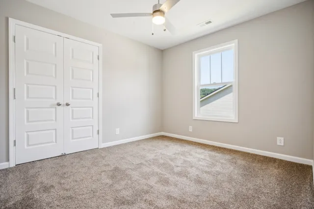 a bathroom with a sink toilet vanity and tub