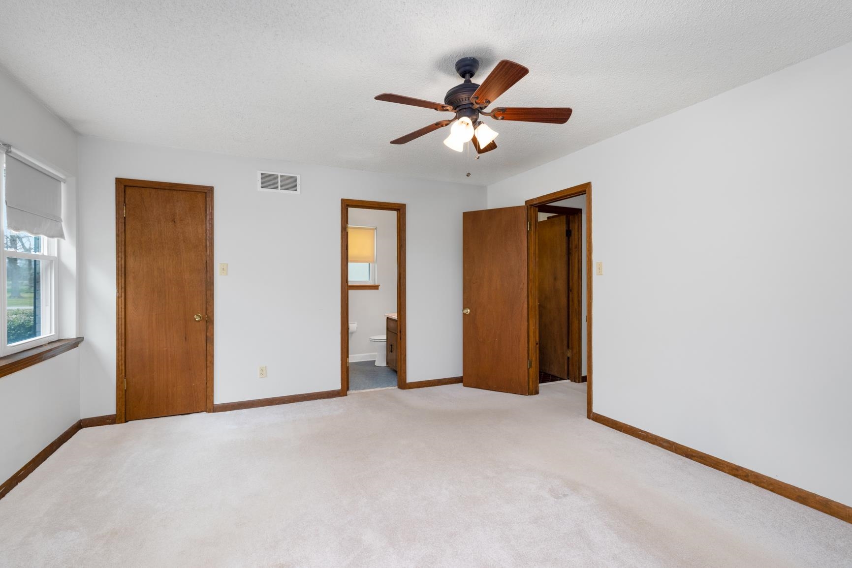 8292 Rankin Branch Road Millington, TN 38053 - Photo 16 of 33 a view of a livingroom with a ceiling fan and window