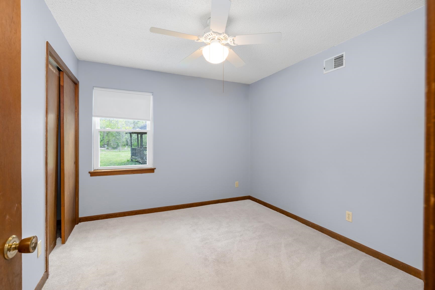 8292 Rankin Branch Road Millington, TN 38053 - Photo 18 of 33 an empty room with a window and a fan