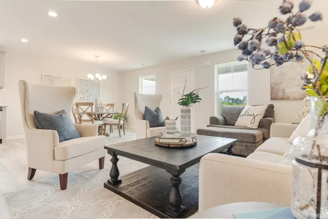 a living room with furniture and a table