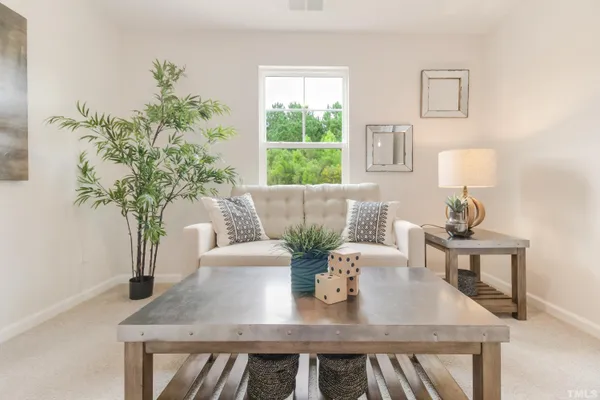 a view of table and chair with wooden floor