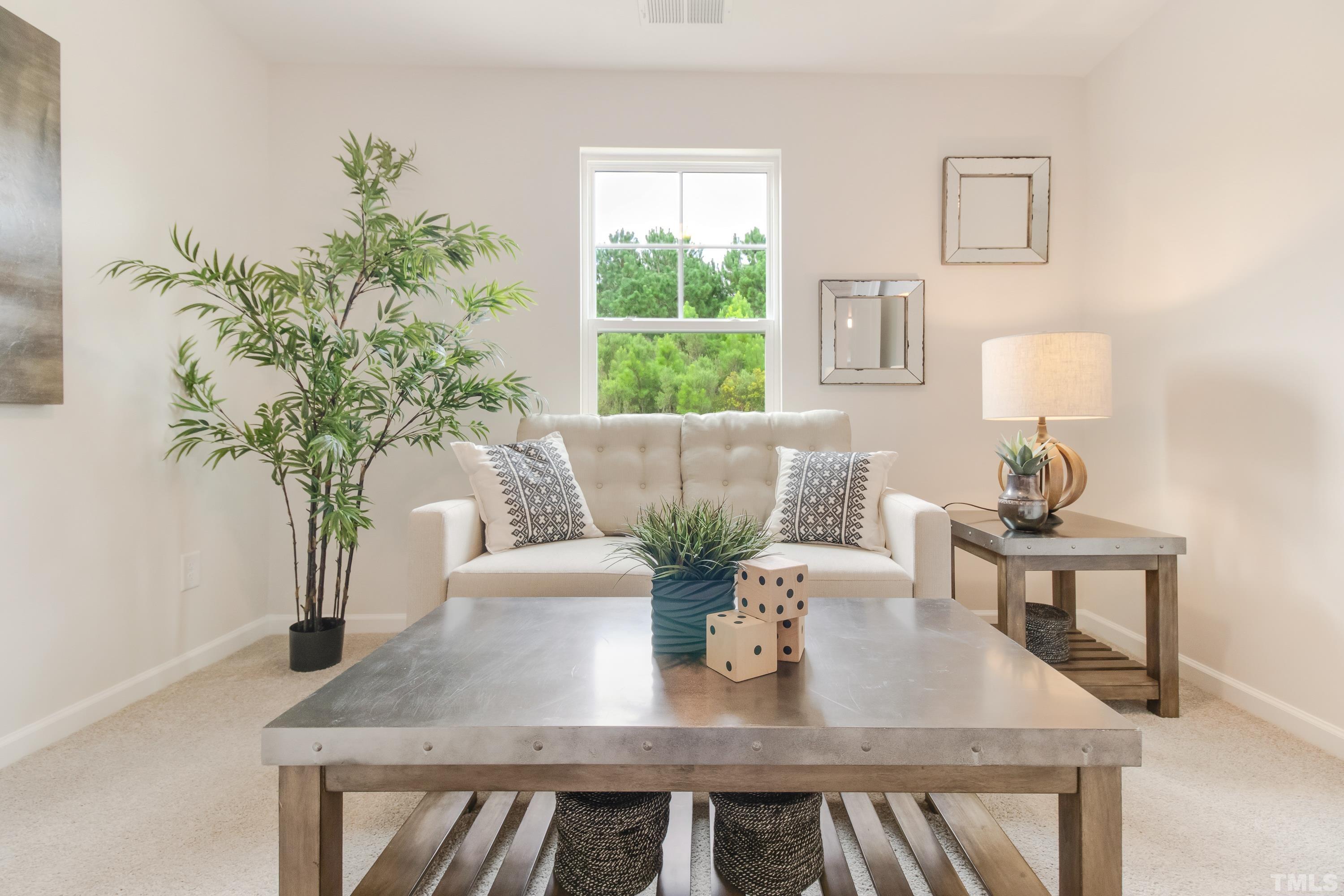 385 Dasu Drive Clayton, NC 27520 - Photo 19 of 33 a view of table and chair with wooden floor