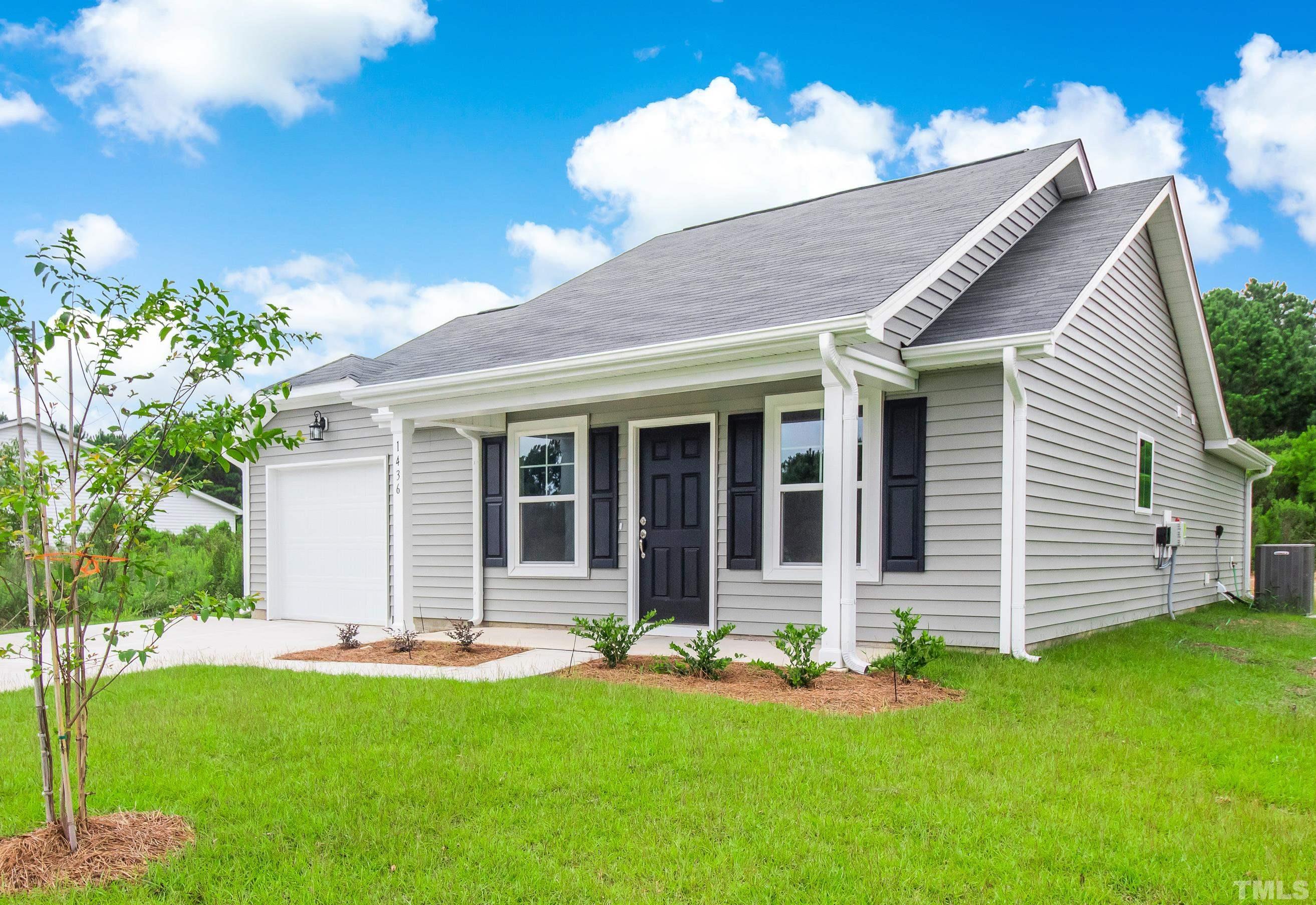 385 Dasu Drive Clayton, NC 27520 - Photo 2 of 33 front view of a house with a yard