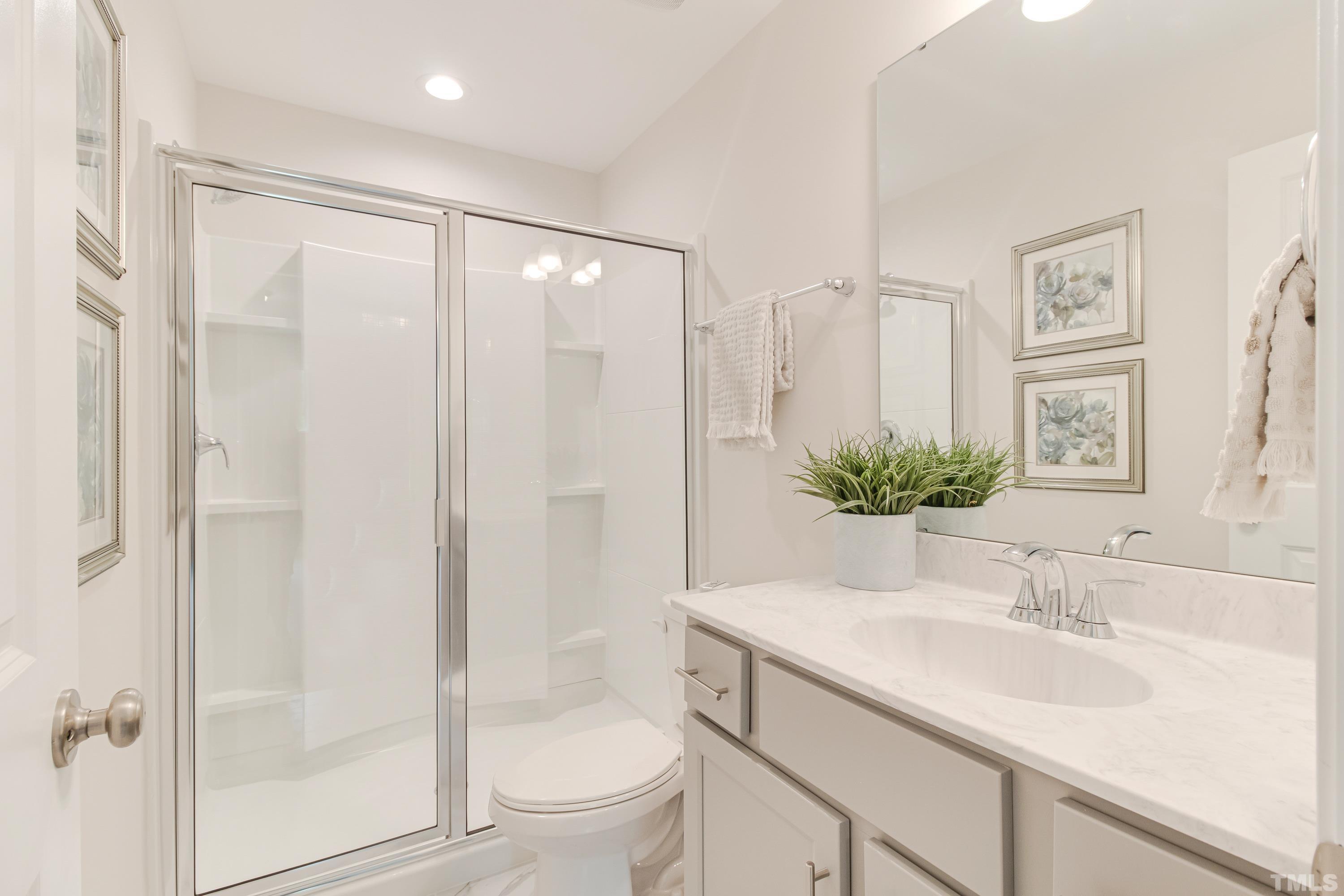 385 Dasu Drive Clayton, NC 27520 - Photo 26 of 33 a bathroom with a sink toilet and shower