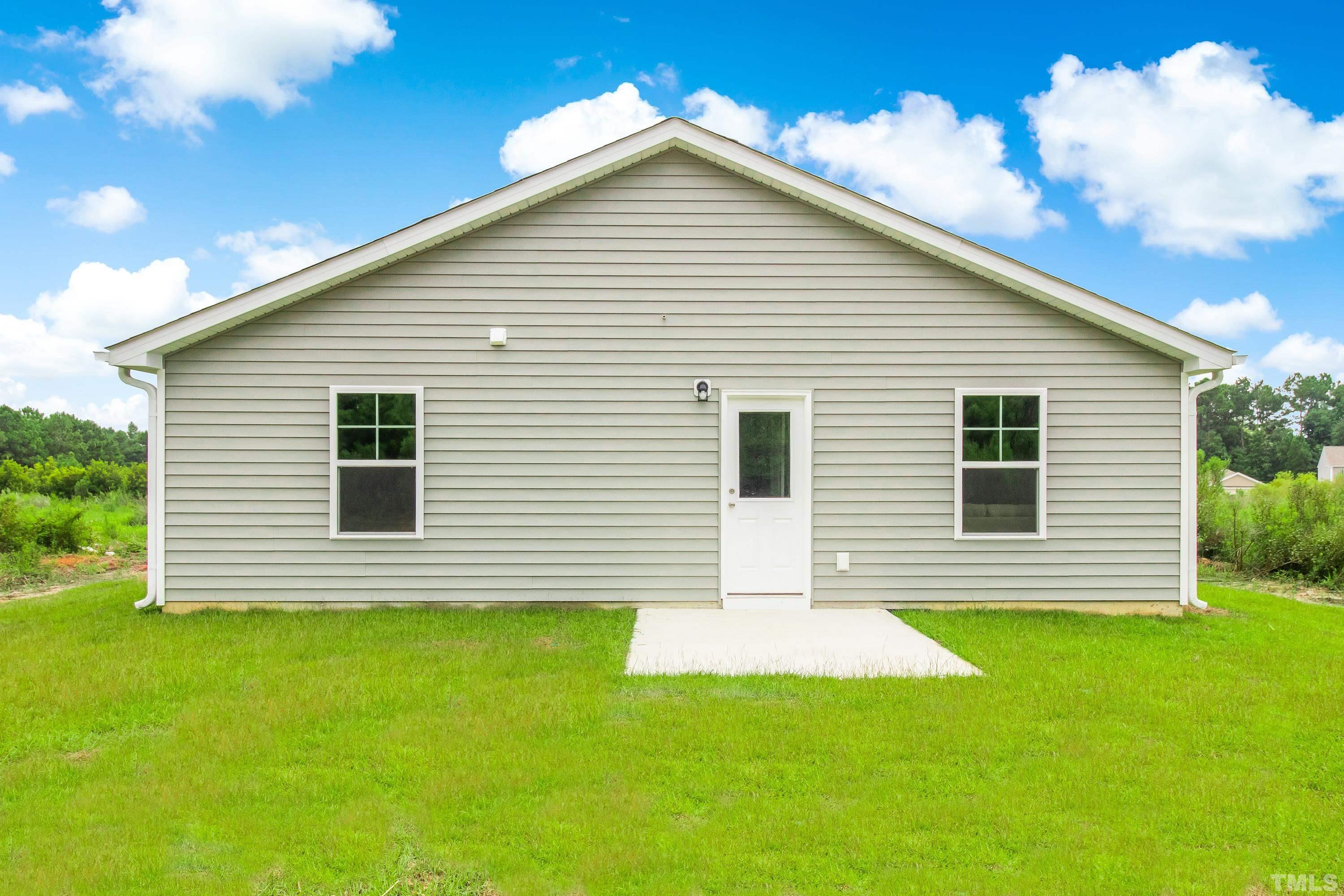 385 Dasu Drive Clayton, NC 27520 - Photo 31 of 33 a view of a house with a backyard