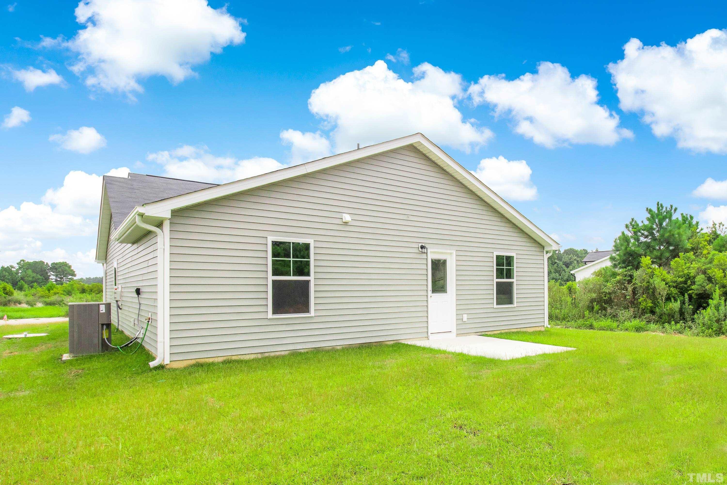 385 Dasu Drive Clayton, NC 27520 - Photo 32 of 33 a view of a house with a backyard
