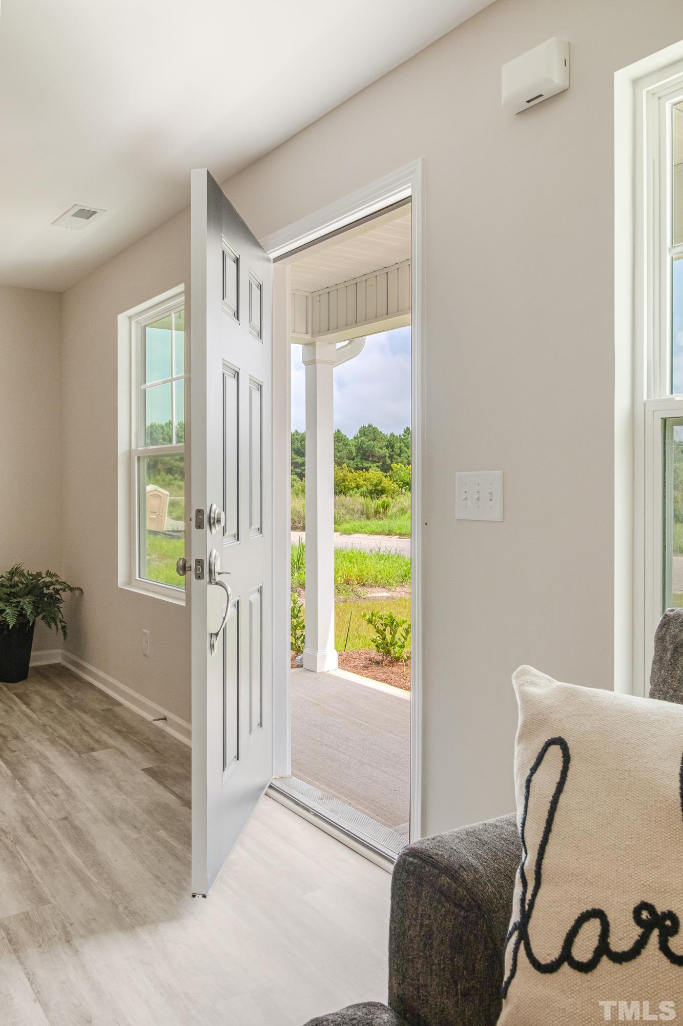 385 Dasu Drive Clayton, NC 27520 - Photo 6 of 33 a view of livingroom with furniture and windows