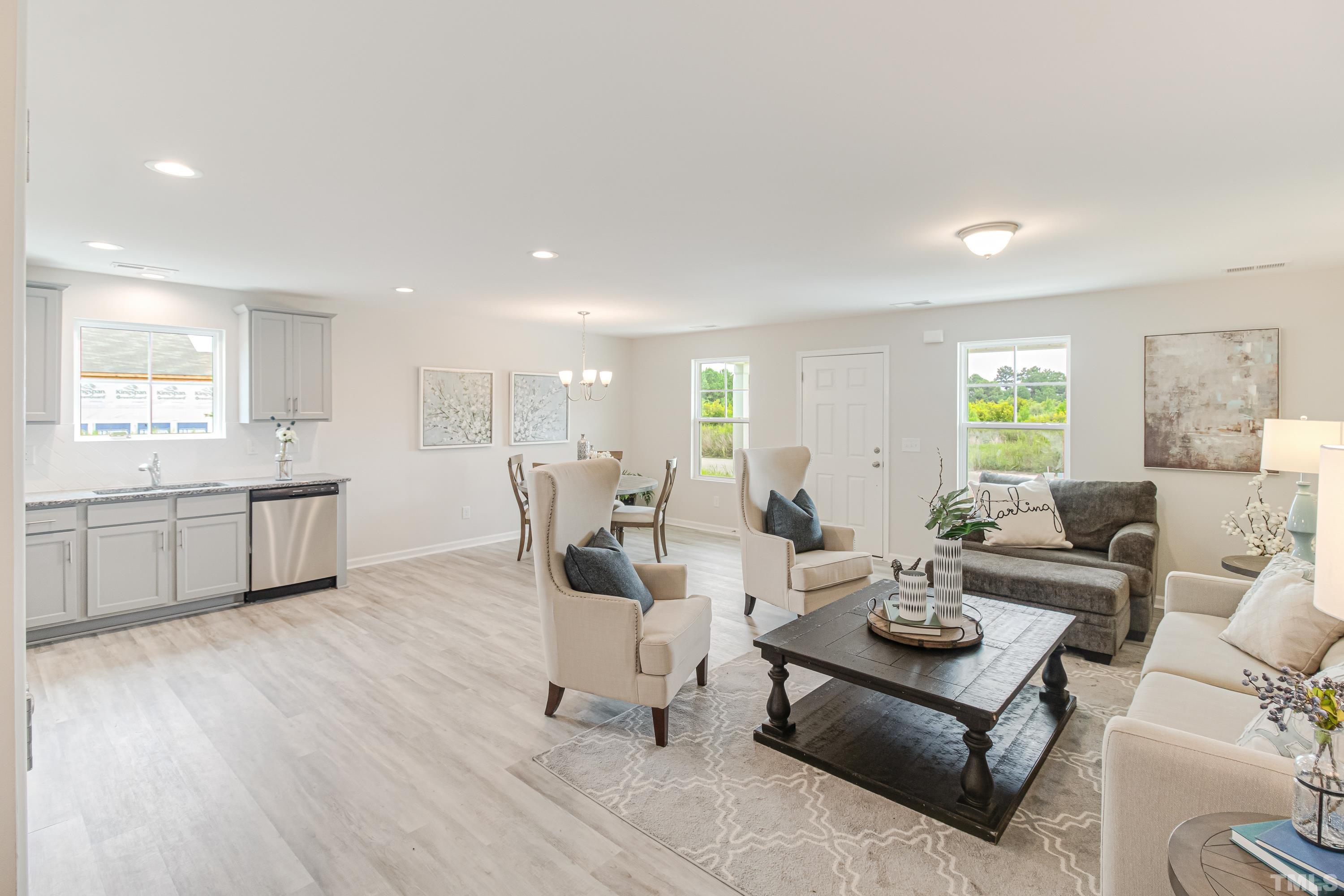 385 Dasu Drive Clayton, NC 27520 - Photo 7 of 33 a living room with furniture and wooden floor