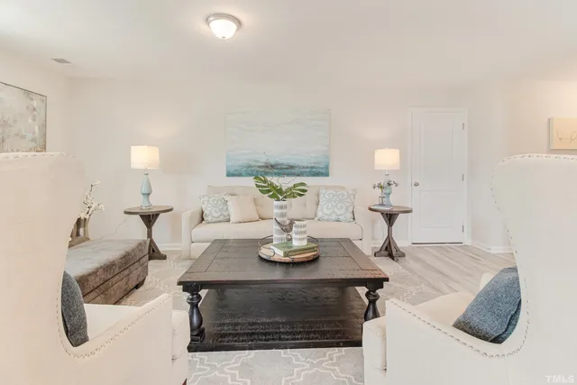 a living room with furniture and a table