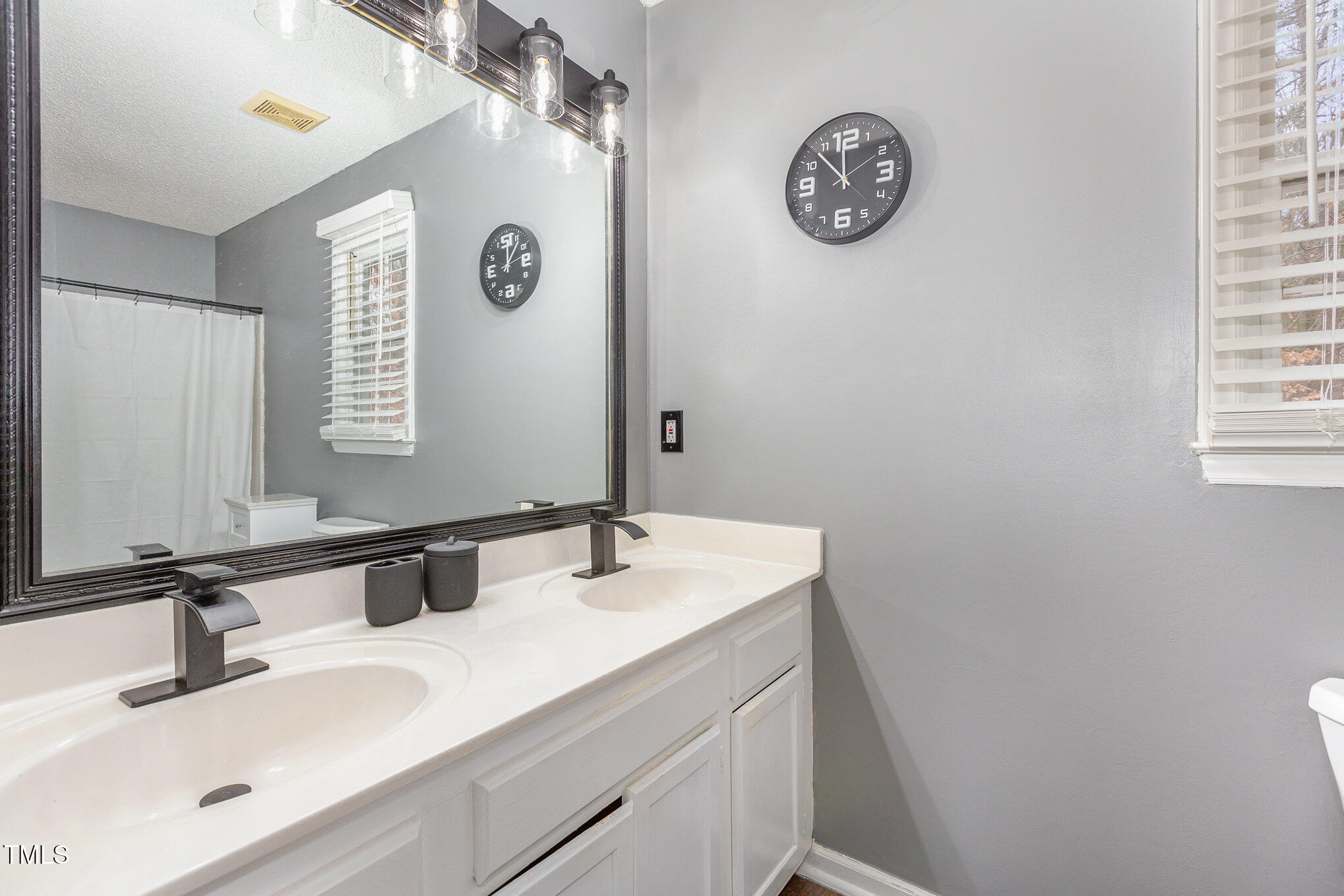 6101 Powder Horn Court Raleigh, NC 27616 - Photo 18 of 24 2nd full bath with all new black fixtures