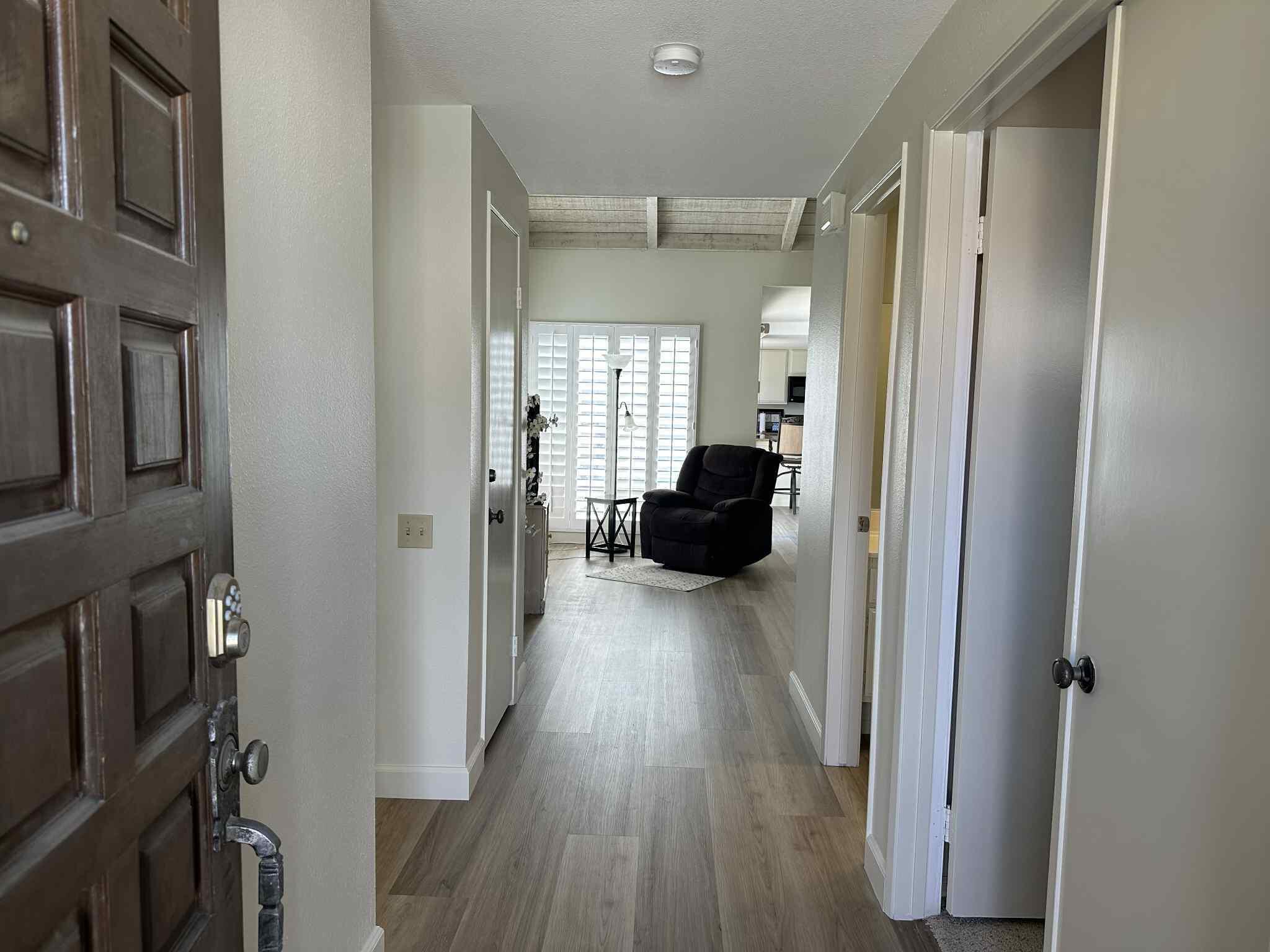 2350 East Miramonte Circle, Unit E Palm Springs, CA 92264 - Photo 9 of 35 a view of entryway with livingroom and wooden floor