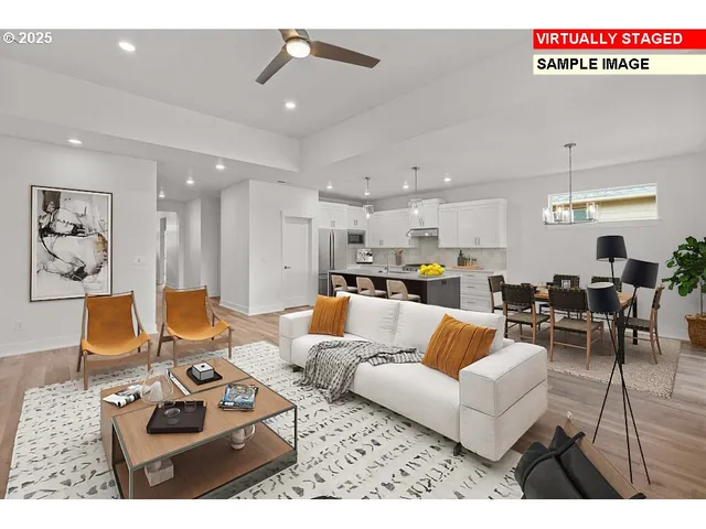 a living room with furniture kitchen view and a chandelier