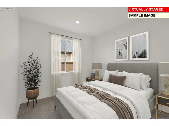 a bedroom with a bed and a potted plant