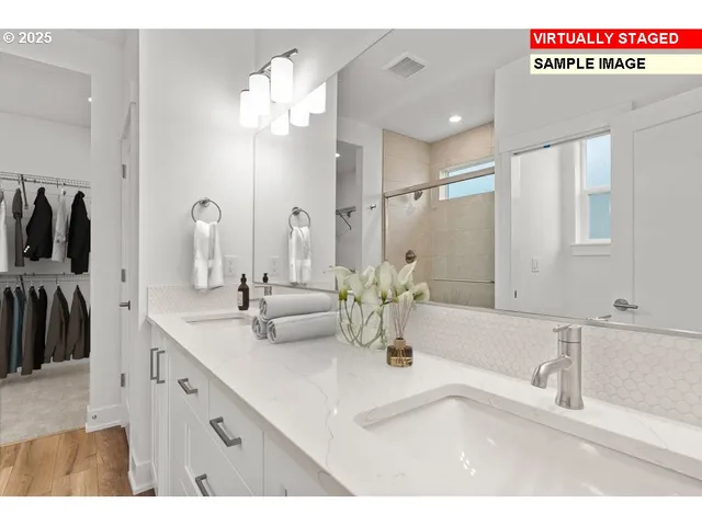 a bathroom with a double vanity sink and a mirror