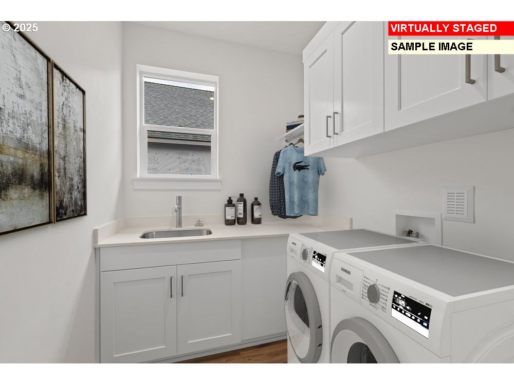 1146 Southeast 18th Avenue Canby, OR 97013 - Photo 8 of 17 a utility room with cabinets washer and dryer