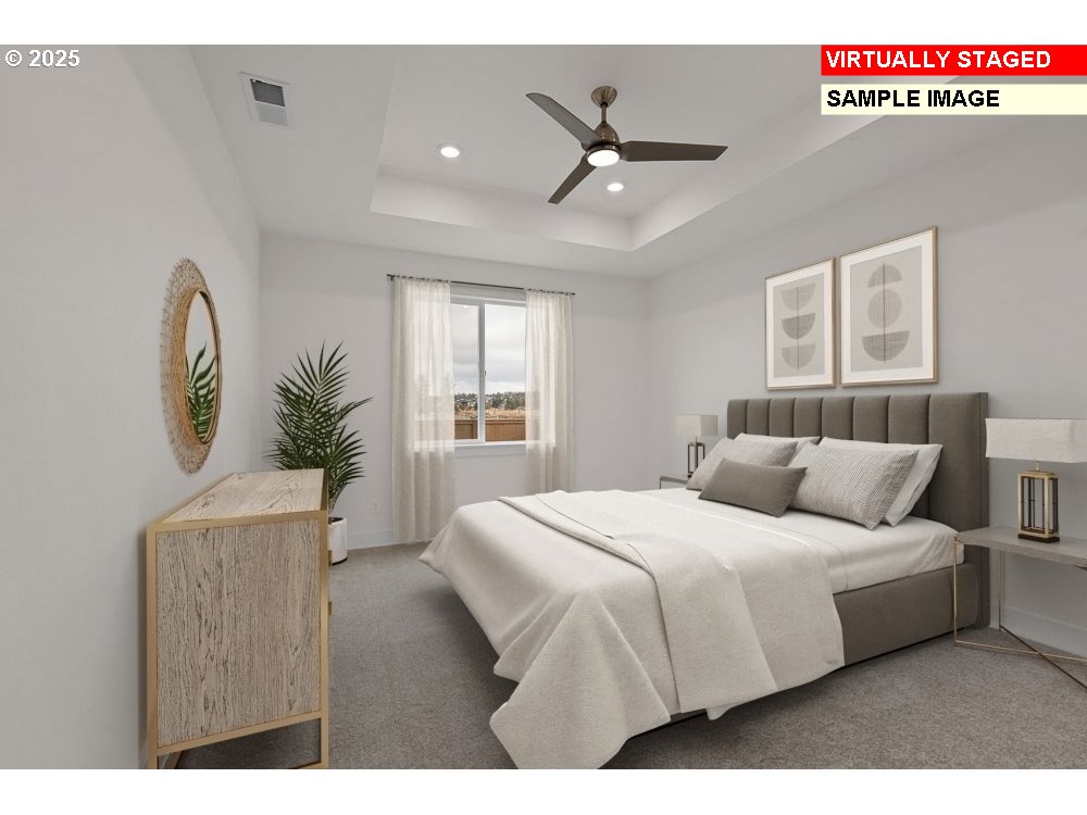 1146 Southeast 18th Avenue Canby, OR 97013 - Photo 9 of 17 a bedroom with a large bed and a chandelier