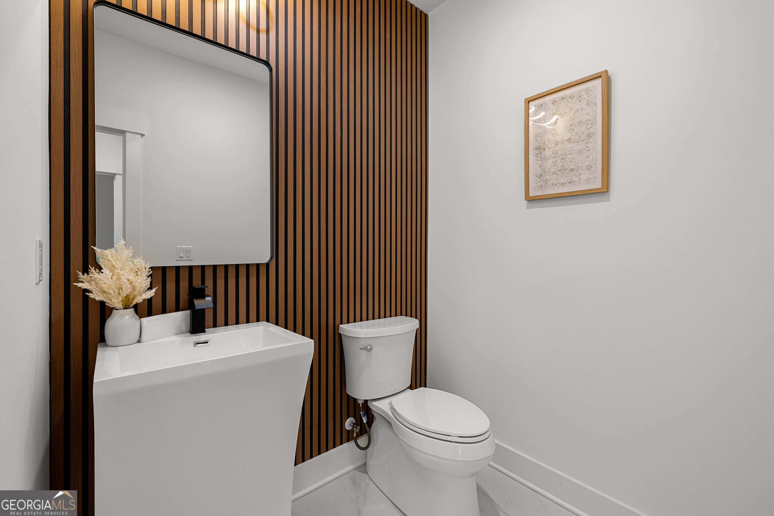 354 Turner Road Newnan, GA 30263 - Photo 57 of 79 a bathroom with a toilet a sink and mirror
